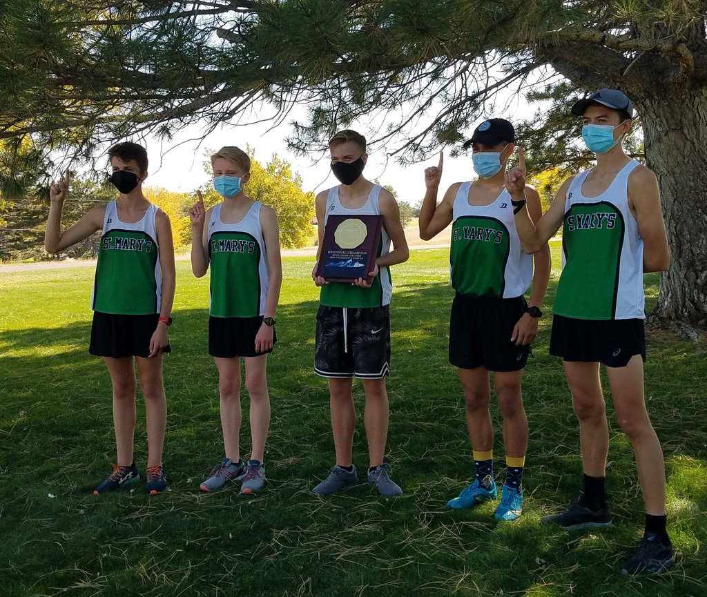 Cross country runners with regional plaque