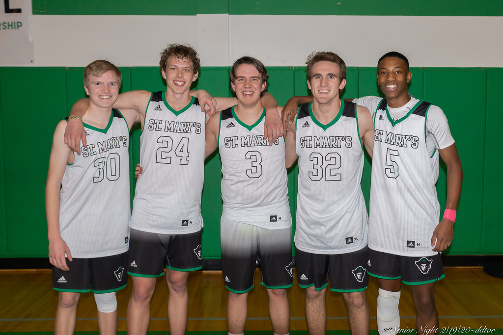 Seniors on the boys basketball team pose together