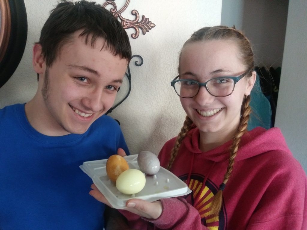 Students with dyed Easter eggs